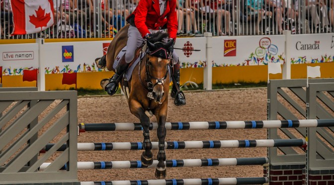 Ian Miller In Action:  Ten-time Olympian jumping Dixson at Pan Am Games