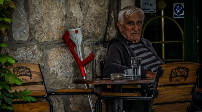 Intently Watching The Street During Afternoon Coffee Break in Croatia
