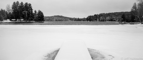 half frozen lake and snow at the baysville cottage