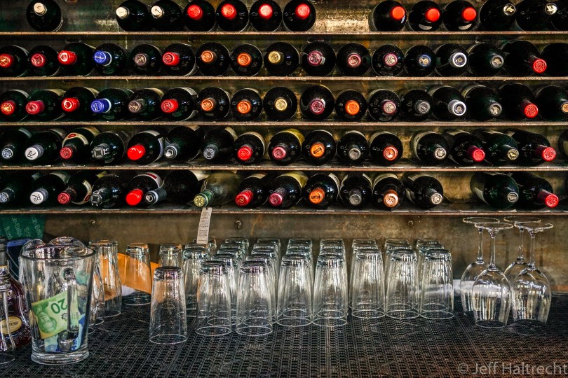 seventy six wine bottles Cardero's Restaurant bar drinking glasses tips