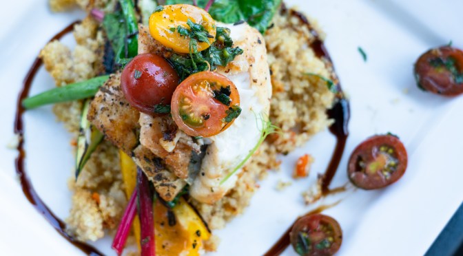 Riverwalk, featuring local pickerel on a bed of quinoa, tomatoes, peppers and wilted Swiss Chard
